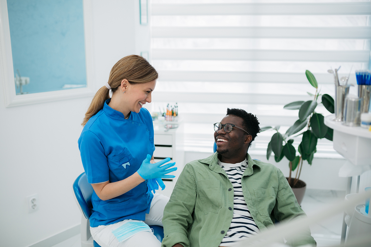 Happy patient looking in a mirror